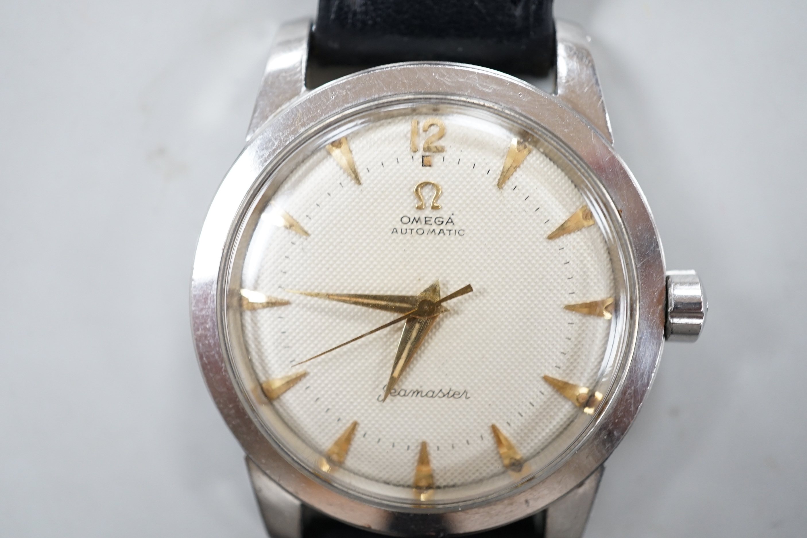 A gentleman's early 1950's stainless steel Omega Seamaster automatic wrist watch, movement c.351, on a leather strap with Omega buckle, no box or papers.